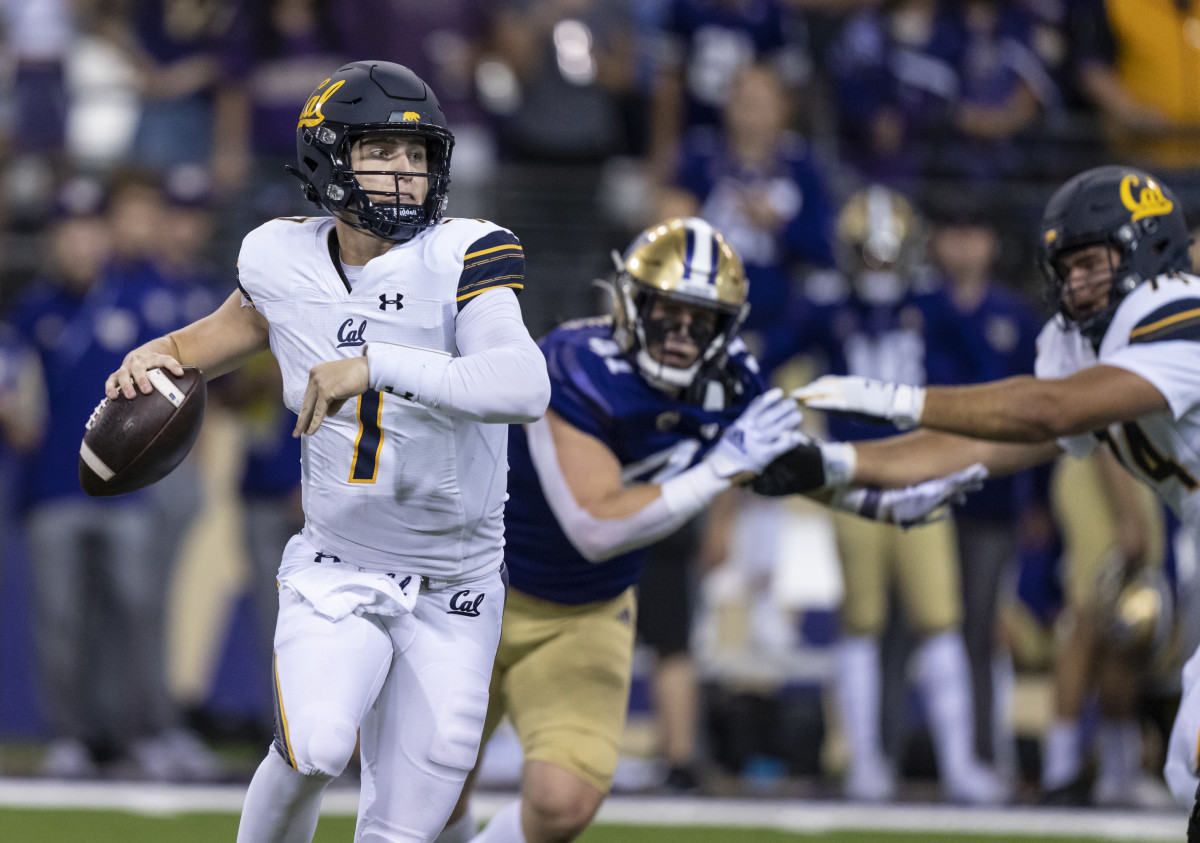 California Golden Bears quarterback Chase Garbers (7) scrambles out of the pocket during the second half against the Washington Huskies at Alaska Airlines Field at Husky Stadium.